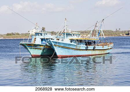 Egyptian Fishing Boats On The Nile River, Rosetta (Rashid), Beheira, Egypt View Large Photo Image Stock Photo - Egyptian Fishing Boats On The Nile River, Rosetta (Rashid), Beheira, Egypt. Fotosearch