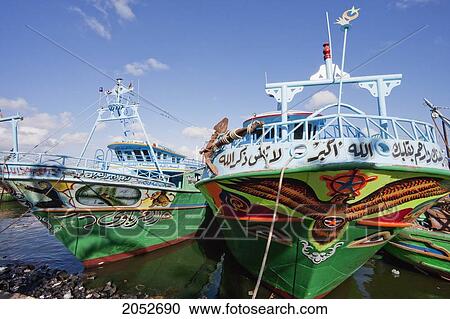 Stock Image - Egyptian Fishing Boats On The Rosetta Branch Of The Nile River, Rosetta (Rashid), Beheira, Egypt. Fotosearch