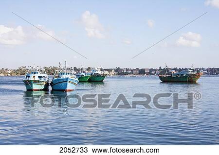 Stock Image - Egyptian Fishing Boats On The Rosetta Branch Of The Nile River, Rosetta (Rashid), Beheira, Egypt. Fotosearch