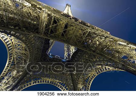 Stock Photograph - Eiffel Tower At Night, Directly Below, Paris, France. Fotosearch