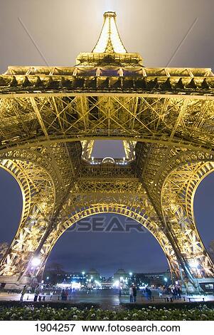 Eiffel Tower At Night, Low Angle View, Paris, France View Large Photo Image Stock Photo - Eiffel Tower At Night, Low Angle View, Paris, France. Fotosearch