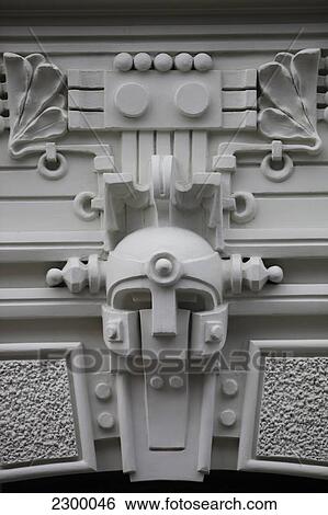 Eisenstein Art Nouveaux buildings in the quiet centre of Riga Strenlnieku iela 4a, 1905 M. Heavy styled over embellished facade. The robotic heads can be interpreted as classical Roman or Greek helmets represented using mechanical form, Riga, Latvia. View Large Photo Image Stock Photograph - Eisenstein Art Nouveaux buildings in the quiet centre of Riga Strenlnieku iela 4a, 1905 M. Heavy styled over embellished facade. The robotic heads can be interpreted as classical Roman or Greek helmets represented using mechanical form, Riga, Latvia.. Fotosearch