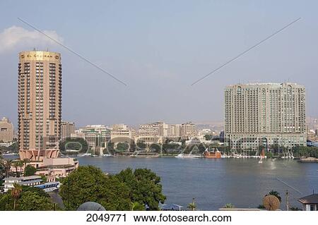 El Gezirah Hotel And Four Seasons Hotel Along The Nile River, Cairo, Al Qahirah, Egypt View Large Photo Image Stock Image - El Gezirah Hotel And Four Seasons Hotel Along The Nile River, Cairo, Al Qahirah, Egypt. Fotosearch