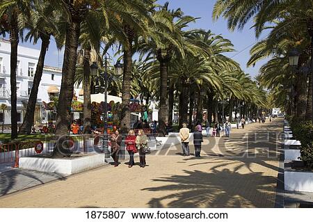 Stock Photo - El Puerto De Santa Maria, Andalusia, Spain; People Walking Down The Promenade. Fotosearch