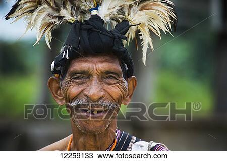 Stock Image - Elderly man in traditional attire; Lospalmos district, Timor-Leste. Fotosearch