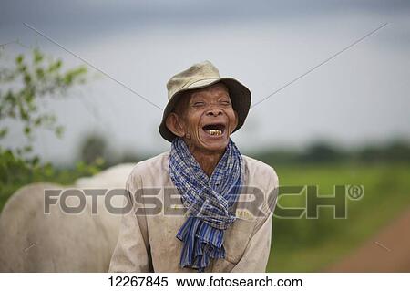 Stock Photography - Elderly man laughing; Battambang, Cambodia. Fotosearch