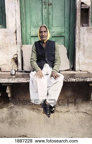 Elderly Man Sitting Outside Village Building View Large Photo Image Stock Photo - Elderly Man Sitting Outside Village Building. Fotosearch