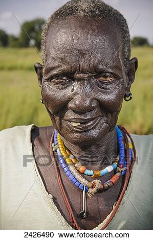 Stock Image - Elderly Nuer woman close to Gambella in Western Ethiopia; Ethiopia. Fotosearch
