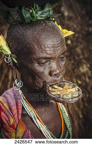 Stock Photo - Elderly Surma woman with traditional lip plate, Omo region, Southwest Ethiopia; Kibish, Ethiopia. Fotosearch