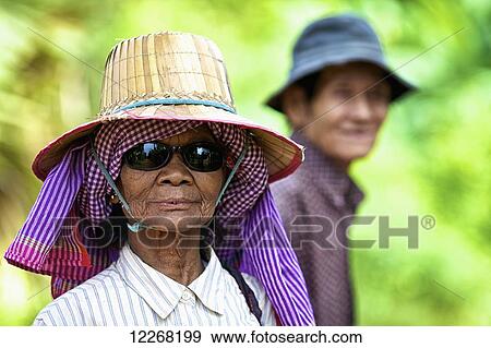 Stock Photo - Elderly woman with her husband; Battambang, Cambodia. Fotosearch