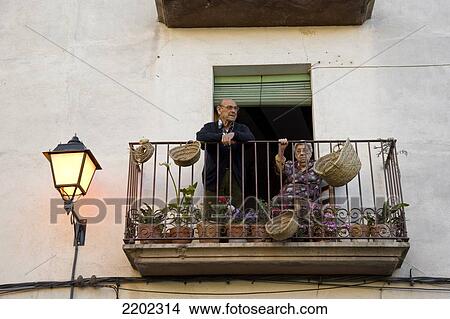 Eldery Couple In The Balcony, Rasquera, Tarragona, Catalunya, Spain View Large Photo Image Picture - Eldery Couple In The Balcony, Rasquera, Tarragona, Catalunya, Spain. Fotosearch