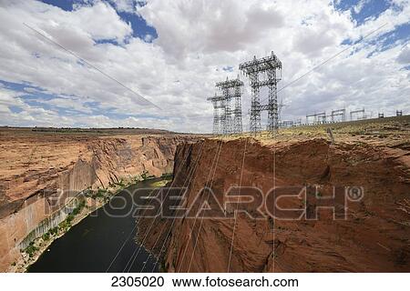 Stock Image - Electricity Wires And Pylons Extending From The Glen Canyon Dam On The Colorado River; Arizona Usa. Fotosearch