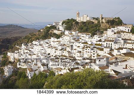 Elevated View Of Village Situated On Hill; Casares, Malaga Province, Spain View Large Photo Image Stock Photo - Elevated View Of Village Situated On Hill; Casares, Malaga Province, Spain. Fotosearch