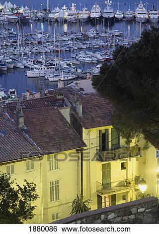 Stock Photograph - Elevated View Over Old Quarter To Harbor At Dusk. Fotosearch