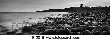 Stock Photography - Embleton Bay With Dunstanburgh Castle In Distance, Northumberland, England, Uk. Fotosearch
