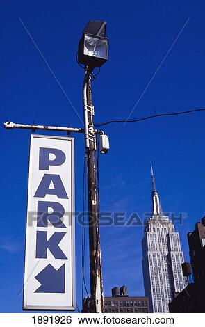 Stock Photograph - Empire State Building And Car Park Sign. Fotosearch
