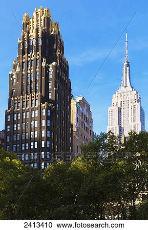 Empire State Building viewed from Bryant Park, Manhattan; New York City, New York, United States of America View Large Photo Image Stock Image - Empire State Building viewed from Bryant Park, Manhattan; New York City, New York, United States of America. Fotosearch