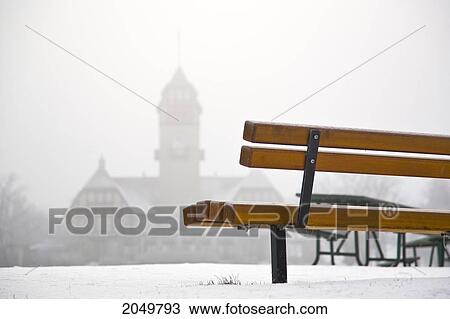 Stock Image - Empty Bench On Foggy Winter Morning, Assiniboine Park, Winnipeg, Manitoba. Fotosearch