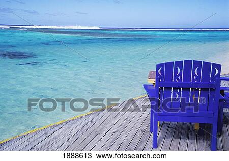Empty Blue Painted Chair On Wooden Deck By Ocean View Large Photo Image Stock Image - Empty Blue Painted Chair On Wooden Deck By Ocean. Fotosearch