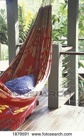 Stock Image - Empty Hammock On Deck In Jungle. Fotosearch