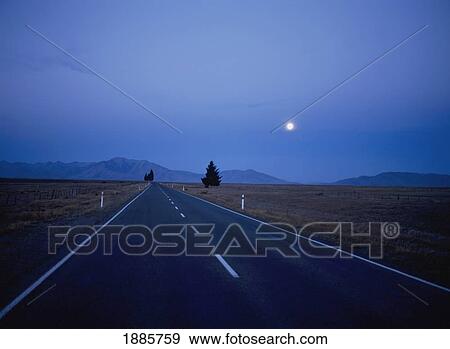 Empty Highway Through Countryside At Night With Moon View Large Photo Image Stock Photo - Empty Highway Through Countryside At Night With Moon. Fotosearch