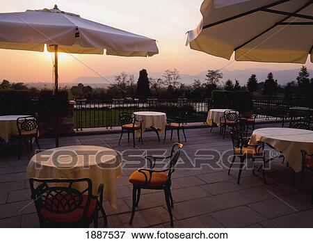 Stock Photo - Empty Restaurant Terrace At Sunset. Fotosearch