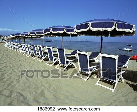 Empty Sun Loungers And Umbrellas On Beach View Large Photo Image Stock Image - Empty Sun Loungers And Umbrellas On Beach. Fotosearch