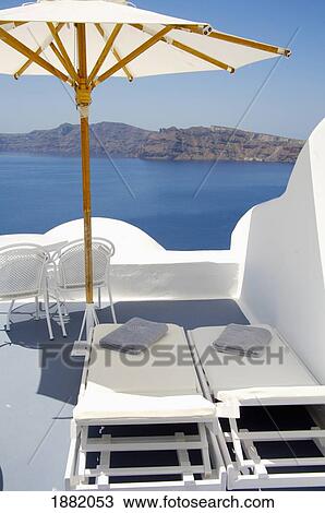 Empty Sunloungers And Umbrella On Roof Terrace By Sea View Large Photo Image Stock Image - Empty Sunloungers And Umbrella On Roof Terrace By Sea. Fotosearch