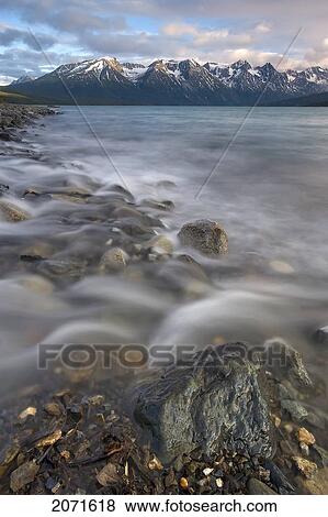 Stock Photo - Engineer Creek Flowing Into Tagish Lake With Coast Mountains In The Distance, Northern British Columbia. Fotosearch