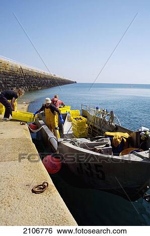 England, Channel Islands, Jersey, Fishermen coming back with lobster catch; St Catherine's Breakwater View Large Photo Image Stock Photograph - England, Channel Islands, Jersey, Fishermen coming back with lobster catch; St Catherine's Breakwater. Fotosearch