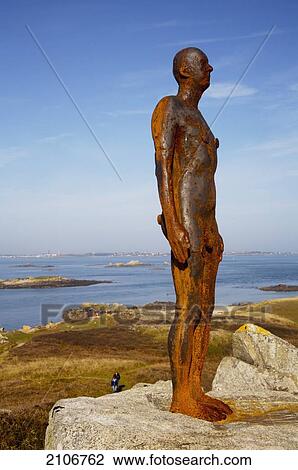 England, Channel Islands, Sculpture on rocky beach; Herm ...