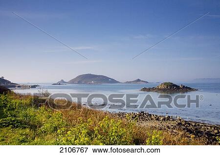 Stock Photo - England, Channel Islands, View of sea and islands; Jethou. Fotosearch