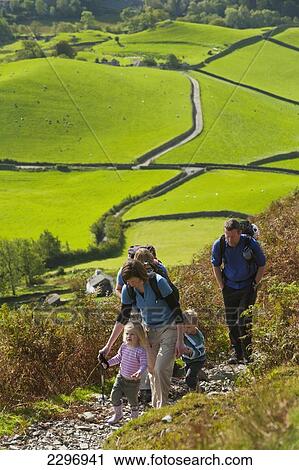 England, Cumbria, Lake District National Park, Parents leading children up path; Little Langdale View Large Photo Image Stock Image - England, Cumbria, Lake District National Park, Parents leading children up path; Little Langdale. Fotosearch