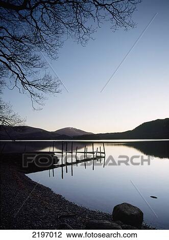 England, Cumbria, Pier before dawn on calm waters of Derwent Water; Lake District View Large Photo Image Stock Image - England, Cumbria, Pier before dawn on calm waters of Derwent Water; Lake District. Fotosearch