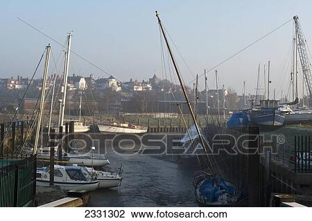 Stock Image - England, East Sussex, Misty winter's morning at Cinque Port of Rye; Rye. Fotosearch
