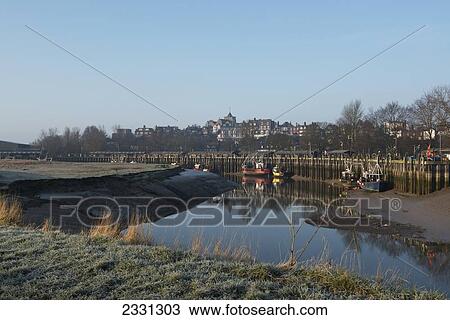 Stock Image - England, East Sussex, Misty winter's morning at Cinque Port of Rye; Rye. Fotosearch