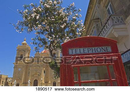 Stock Photo - English Style Phone Booth Near Church Of Our Lady Of Victory. Fotosearch