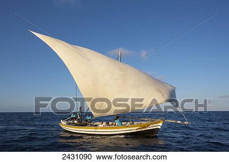 Stock Image - Enjoying a sailboat on the Indian Ocean; Vamizi Island, Mozambique. Fotosearch