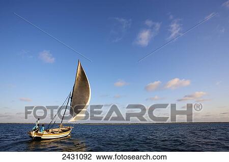 Stock Image - Enjoying a sailboat on the Indian Ocean; Vamizi Island, Mozambique. Fotosearch