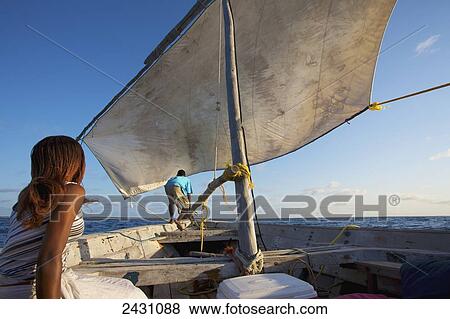 Stock Photo - Enjoying time on a sailboat; Vamizi Island, Mozambique. Fotosearch