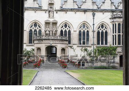 Entrance Of A White Building With Red Flowers Lining The Steps To The Doorway; Oxford England View Large Photo Image Stock Photography - Entrance Of A White Building With Red Flowers Lining The Steps To The Doorway; Oxford England. Fotosearch