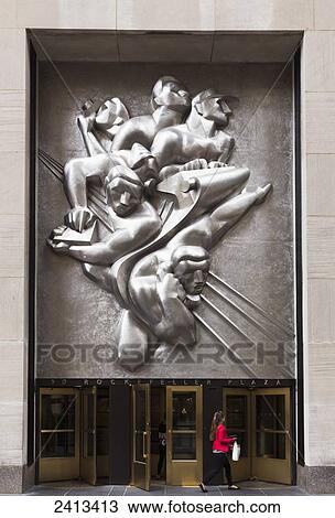Entrance to 50 Rockefeller Center with News Sculpture, Manhattan; New York City, United States of America View Large Photo Image Stock Image - Entrance to 50 Rockefeller Center with News Sculpture, Manhattan; New York City, United States of America. Fotosearch