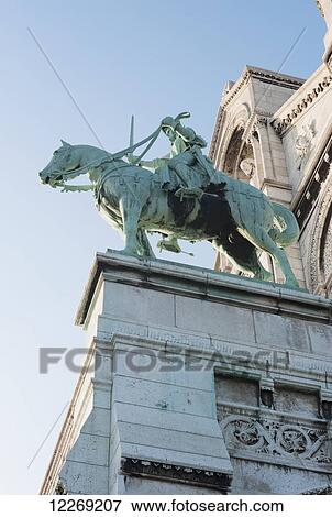 Equestrian statue at the Basilica of the Sacred Heart of Paris; Paris, France View Large Photo Image Stock Photo - Equestrian statue at the Basilica of the Sacred Heart of Paris; Paris, France. Fotosearch