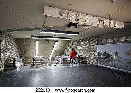 Stock Photo - Escalator and directional signs in the underground city; Montreal quebec canada. Fotosearch