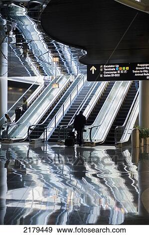 Stock Photo - Escalators In An Airport; Montreal Quebec Canada. Fotosearch