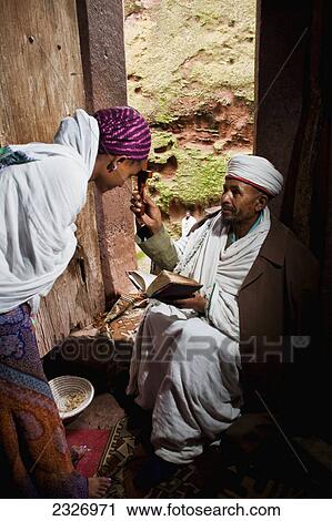 Ethiopia, Ethiopian Orthodox priest blesses a pilgrim; Lalibela View Large Photo Image Stock Image - Ethiopia, Ethiopian Orthodox priest blesses a pilgrim; Lalibela. Fotosearch