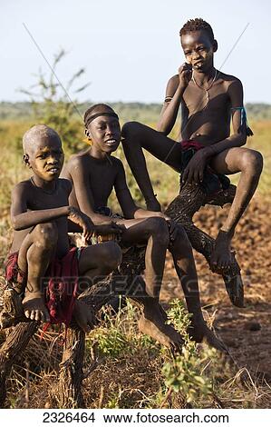 Ethiopia, Omo Valley, Southern Mursiland, Portrait of Three Mursi boys; Dirikoro View Large Photo Image Picture - Ethiopia, Omo Valley, Southern Mursiland, Portrait of Three Mursi boys; Dirikoro. Fotosearch