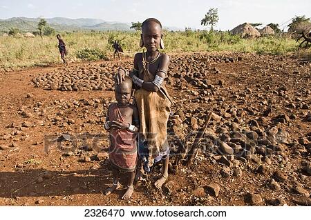 Ethiopia, Omo Valley, Southern Mursiland, Portrait of Mursi children; Dirikoro View Large Photo Image Stock Image - Ethiopia, Omo Valley, Southern Mursiland, Portrait of Mursi children; Dirikoro. Fotosearch