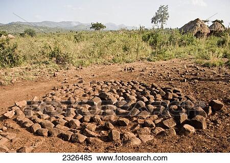 Stock Photography - Ethiopia, Omo Valley, Southern Mursiland, View of village and field; Dirikoro. Fotosearch