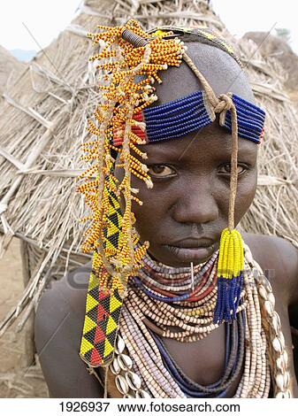 Stock Photo - Ethiopia, Portrait of Karo woman wearing bedded decoration; Omo Valley. Fotosearch